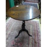 A George III circular oak tripod wine table, Diam.50cm H.71cm