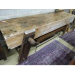 A 19th century pine workbench with original vice, W.244cm D.70cm H.83cm