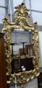 A George III style carved giltwood wall mirror, W.60cm H.114cm