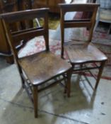 A set of four Victorian elm chapel chairs