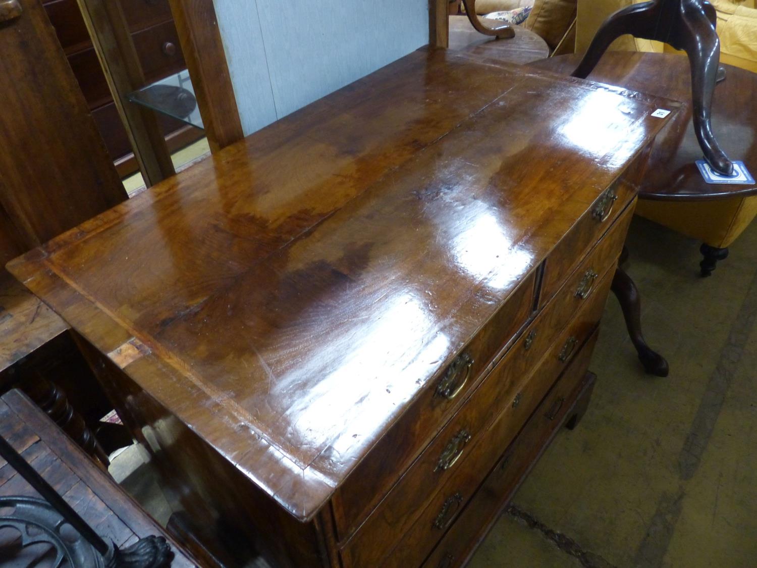 An 18th century crossbanded walnut chest of two short and three graduated long drawers, on bracket - Image 2 of 2