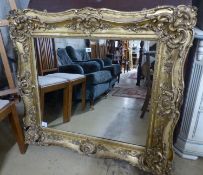A Victorian giltwood and gesso rectangular wall mirror, (formerley a picture frame), W.110cm H.