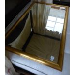 A contemporary rectangular gilt framed wall mirror, W.150cm H.96cm