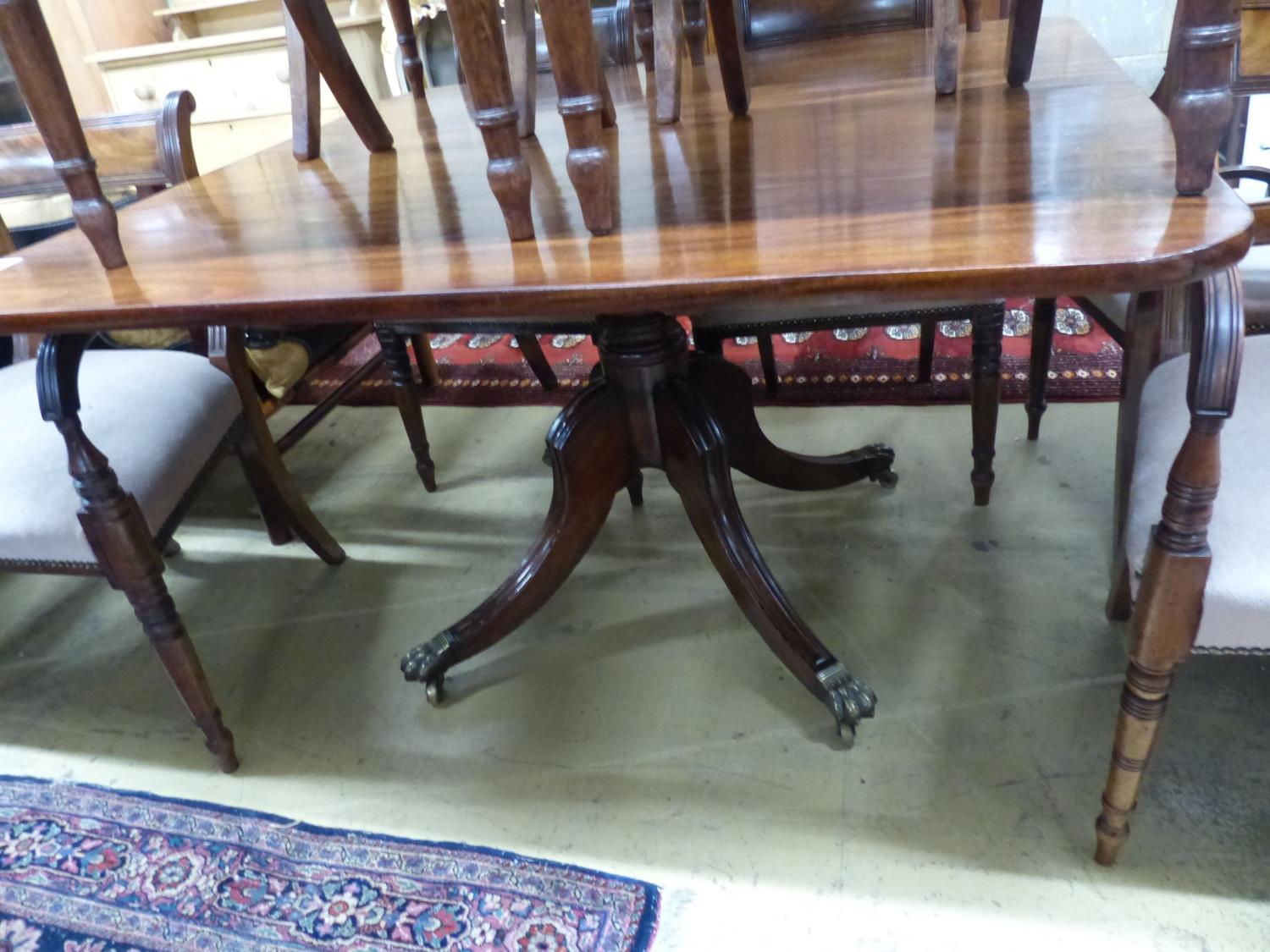 A Regency mahogany tilt top dining table, together with a harlequin set of ten Regency mahogany - Image 2 of 3