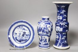 A Chinese blue and white gu vase, a baluster vase and a dish, tallest 26cm