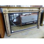 A Regency giltwood and gesso overmantel mirror, with ebonised slip, W.136cm H.81cm