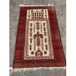 A Persian ivory ground rug, with geometric field, 150 x 91cm