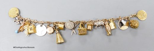 A 9c charm bracelet, hung with nineteen assorted charms, gross 38 grams.