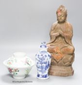 A 20th century carved wooden Buddha, height 34cm, a 19th century Chinese blue and white lidded