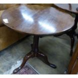 A George III circular mahogany tilt top tripod tea table, Diam.71cm H.70cm