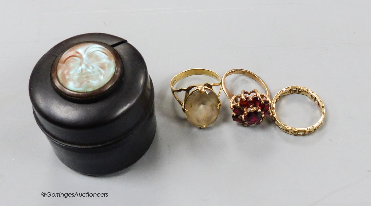 Three assorted 9ct gold and gem set rings, gross 8 grams.