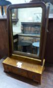 An 18th century and later figured walnut toilet mirror, the box base fitted with three drawers, W.