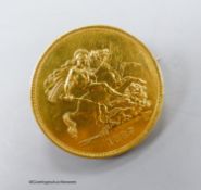 An 1887 £5 gold coin, now mounted as a brooch, gross 41.2 grams.