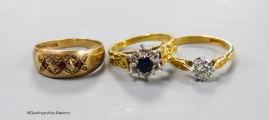 Two 18ct and gem set dress rings, gross 6.4 grams and a 9ct and gem set ring, gross 2.1 grams.
