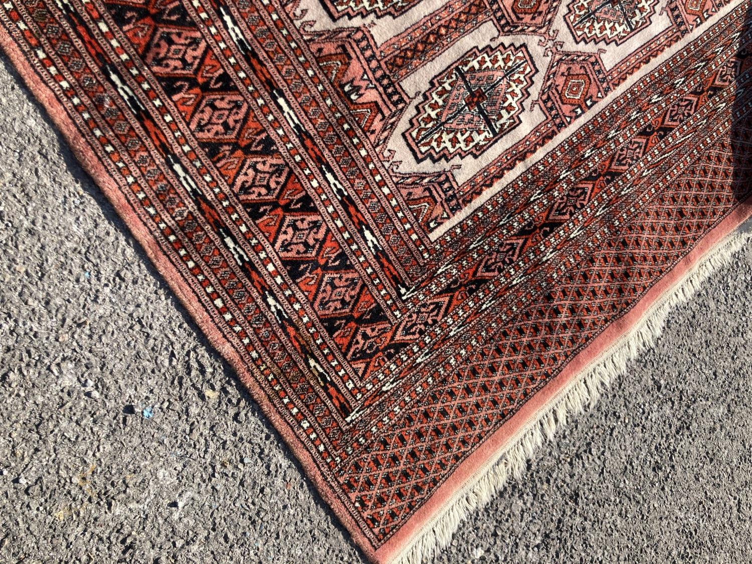 A pale red ground Tekke rug with signed border, 260 x 162cm - Image 4 of 4