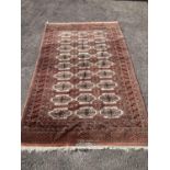 A pale red ground Tekke rug with signed border, 260 x 162cm