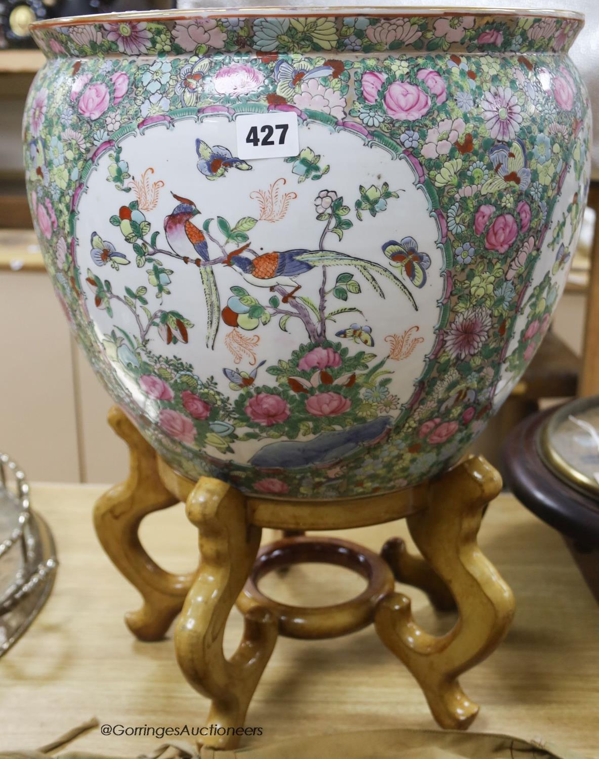 A modern Cantonese export famille rose fish bowl, on hardwood stand, overall height 51cm