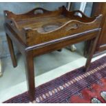 A 19th century rectangular mahogany butler’s tray occasional table, on associated stand, W.64cm D.