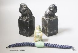 A pair of hardstone carved Temple dogs, height 13cm, a Buddha and a jade bead bracelet