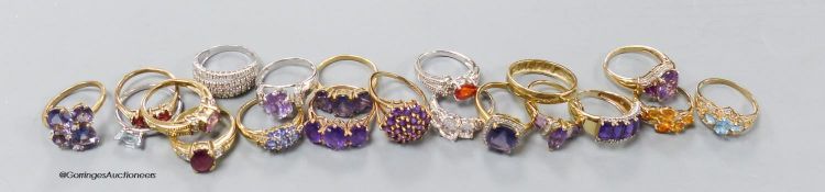 Twenty assorted modern 9ct or 9k and gem set dress rings, gross 60 grams.