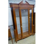 A Biedermeier style ebony inlaid mahogany breakfront display cabinet, W.120cm D.47cm H.197cm