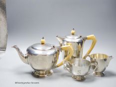 A 1930's Art Deco silver four piece tea set, with ivory handles, by Edward Barnard & Sons, London,