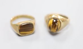 Two modern 9ct gold and tiger's eye quartz set signet rings, sizes S & U/V,gross 13.8 grams.
