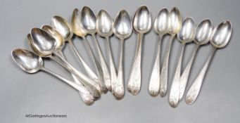 A matched set of ten mainly George III Irish silver feather edge dessert spoons including one