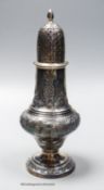 A late Victorian repousse silver sugar caster, marks rubbed, 18.5cm, 4oz.