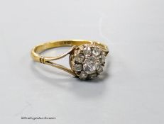 An 18ct and old round cut diamond set cluster ring, size Q, gross weight 2.5 grams.