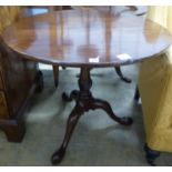 A George III mahogany birdcage tea table, with circular tilt top on wrythen fluted stem, Diam.83cm