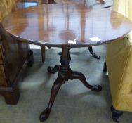 A George III mahogany birdcage tea table, with circular tilt top on wrythen fluted stem, Diam.83cm