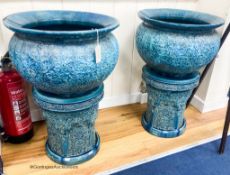 A pair of large Burmantofts style blue glazed moorish design jardinieres and stands- ex Christies