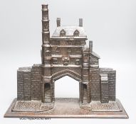 A 19th century carved oak model of a medieval Gatehouse, stamped A. Cotgreave, and inscribed 1774,