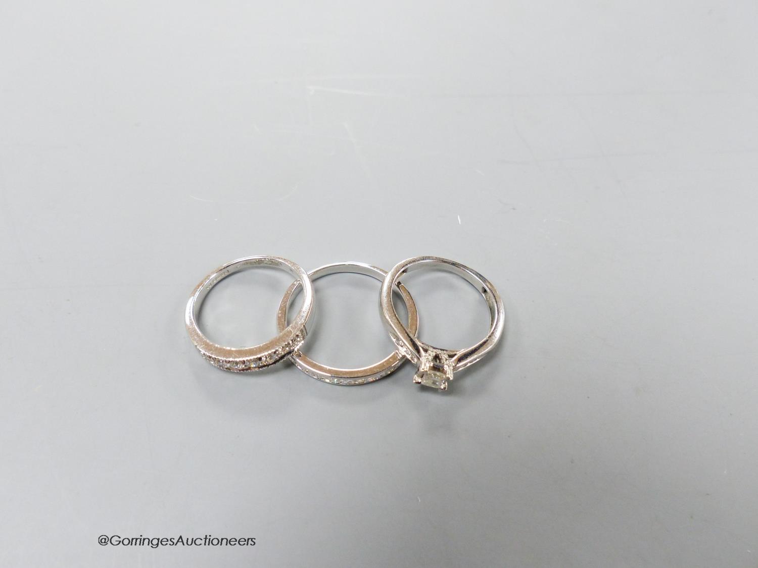 Two modern 9ct white gold and diamond set rings including a seven stone half hoop and a white metal - Image 3 of 3