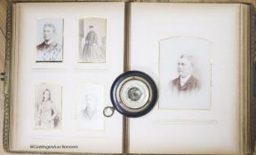 A Victorian monochrome photograph album and an aneroid barometer