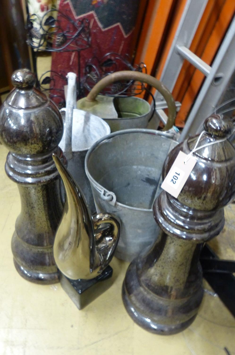 Assorted galvanized watering cans and assorted other metalware.