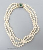 A triple strand cultured pearl set choker necklace, with two colour paste set yellow metal clasp,
