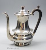 A white metal (stamped sterling silver) coffee pot, height 22cm, gross weight 26.5oz.