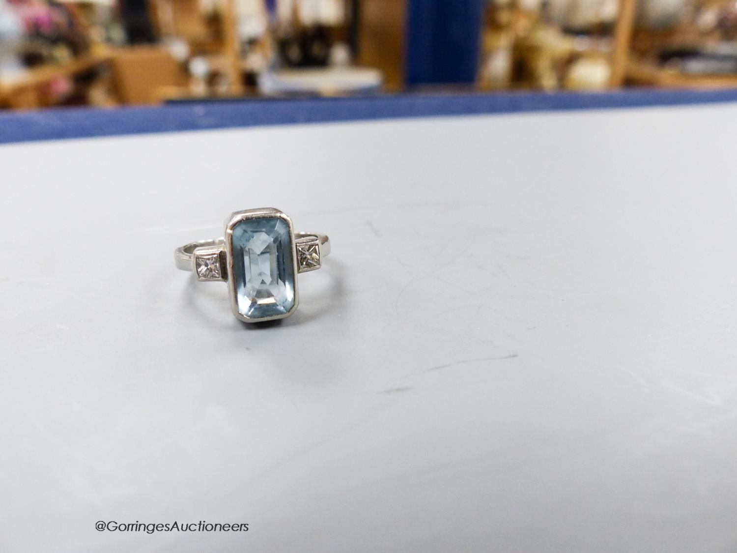 A modern platinum, aquamarine and diamond set three stone dress ring, size N, gross weight 6.8 - Image 2 of 2