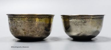 Two 18th century Swedish white metal small bowls, one with inset coin base dated 1708, height 31mm,