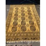 An Afghan gold ground carpet, 300 x 200cm