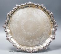 An Edwardian engraved shaped circular silver salver, with scroll border and later engraved
