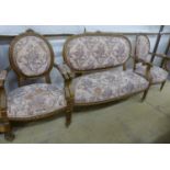 A Louis XV style carved wood three piece salon suite, settee W.118cm D.46cm H.95cm