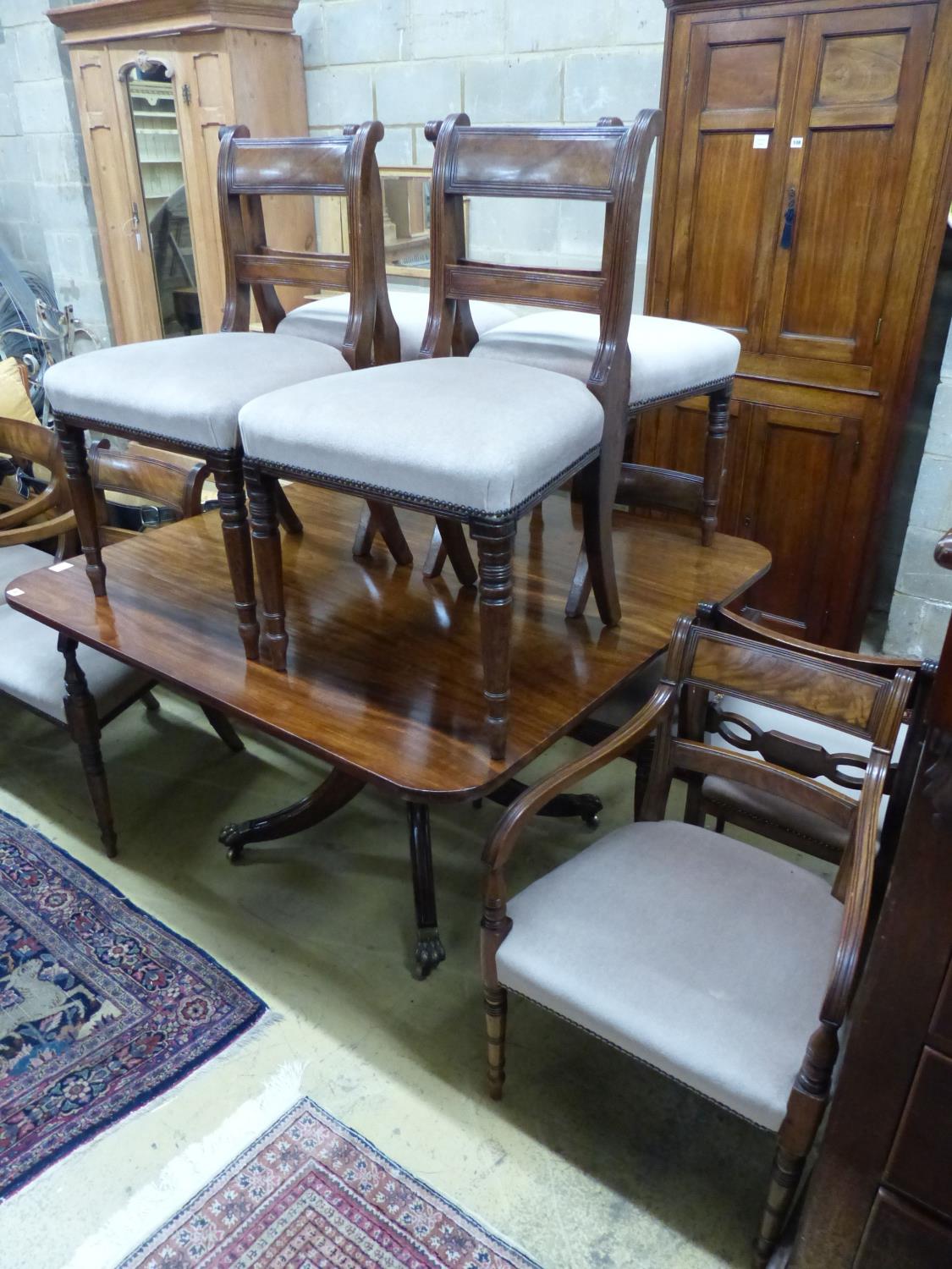 A Regency mahogany tilt top dining table, together with a harlequin set of ten Regency mahogany