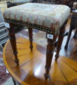 A small Regency mahogany upholstered stool, on fluted legs, W.35cm D.29cm H.51cm