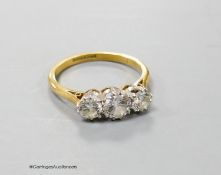 An 18ct & Pt mounted three stone diamond ring, size O, gross 3.2 grams.