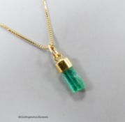 A modern Italian 750 yellow metal and emerald set pendant, 13mm, on a finelink chain, 39cm, gross