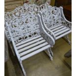 A Victorian style Coalbrookdale design painted metal garden bench and two armchairs, bench W.126cm