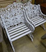 A Victorian style Coalbrookdale design painted metal garden bench and two armchairs, bench W.126cm